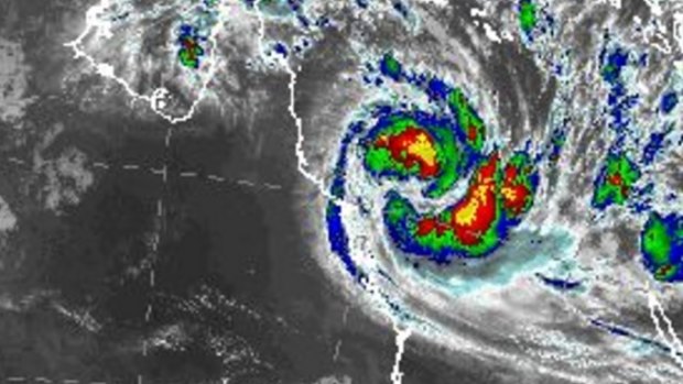 Tropical Cyclone Debbie intensified to a category two system overnight and was expected to make landfall between Townsville and Proserpine on Tuesday morning as a category four.