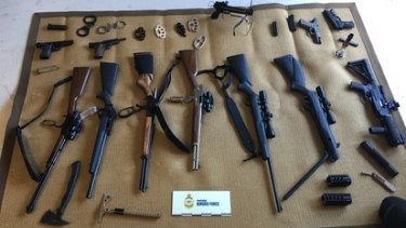 Guns and weapons seized from a property in Queensland.