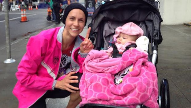 Julia Webb celebrates her new pram running 10km world record with her running partner, a friend's daughter. 