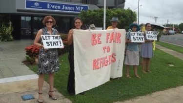 The image that emerged on Tuesday of Labor candidate Cathy O'Toole (left)  attending a rally outside the office of Coalition MP Ewen Jones.