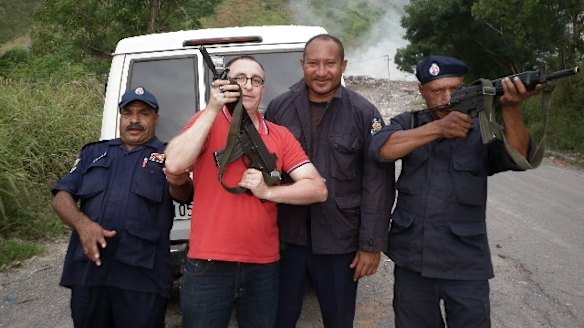 Nathan Sykes with unidentified men in Papua New Guinea in about 2012.