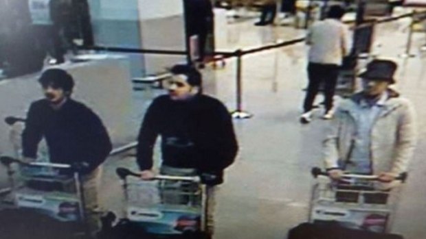 A hunt is under way for a "man in white", one of three men filmed pushing luggage trolleys in Zaventem Airport before the blasts in the departure hall. Authorities say the other two men, dressed in black, were suicide bombers.
