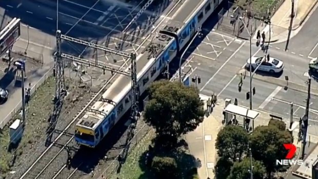 The truck driver and a train passenger were assessed by paramedics.