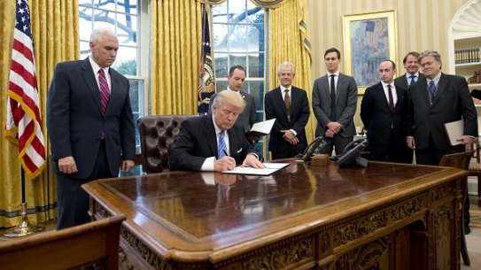 US President Donald Trump signs an executive order reinstating the gag rule prohibiting receivers of aid from discussing abortion.  