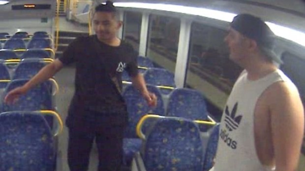 Two of the men to whom police want to speak after a teenager was robbed on a train.