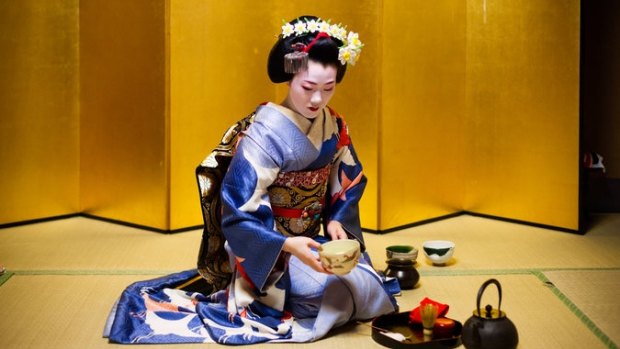 Tomitae is a maiko, a geisha in training.