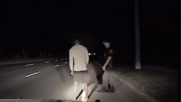 Tiger Woods carrying out a sobriety test with Florida police. 