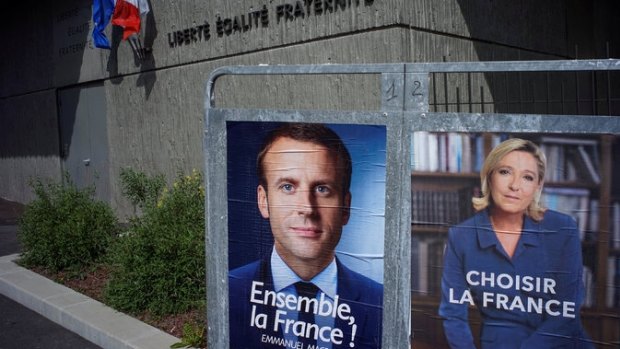 Posters for Emmanuel Macron and Marine Le Pen in advance of France’s presidential run-off election.