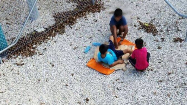 Children play near the detention centre.