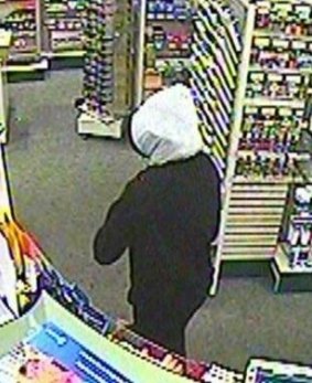 Police have released images of a man they want to speak to over a Labrador attempted armed robbery