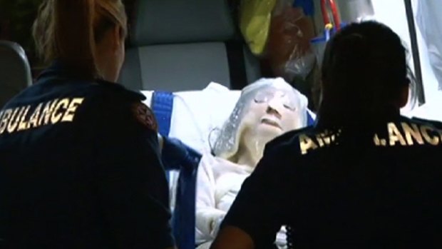 The woman being taken to hospital after being set alight in Chippendale in 2012.