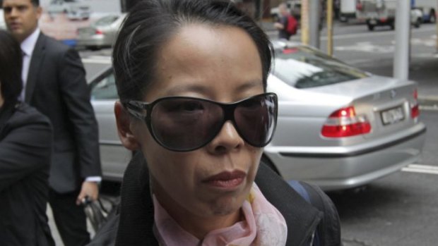 Robert Xie's wife Kathy Lin arrives at the Supreme Court during the trial.