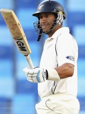 Ross Taylor raises his bat after 50 runs before he reached 100.