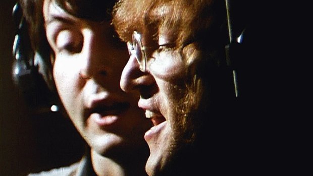 Paul McCartney, left, and John Lennon of The Beatles during the recording of the track "Hey Bulldog"  at the Abbey Road studios in London in 1968.