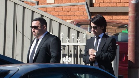 Michael Ibrahim, left, and his brother Fadi attend the funeral of Wally Ahmad in 2016.