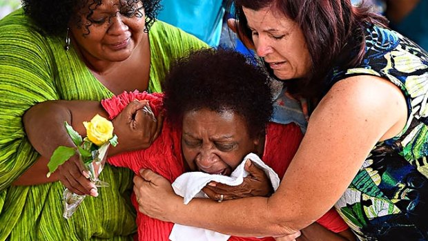 Grieving family after eight children were killed in the Cairns suburb of Manoora.