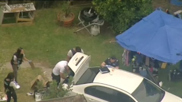 Police at a house in Ashburton where four of the escapees were arrested on Thursday morning.