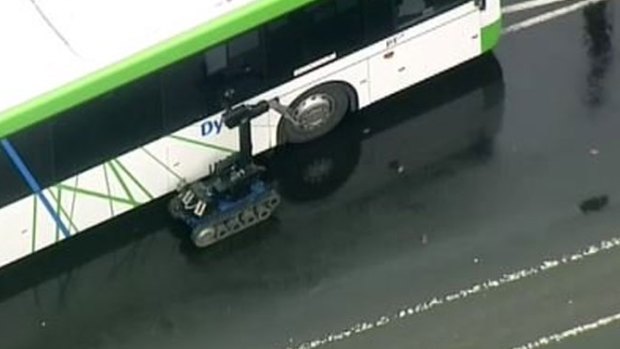The bomb squad robot next to a bus at Moonee Ponds.