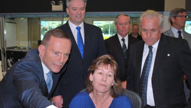 Tony Abbott and WA politicians take a tour of Main Roads operation centre following his flying visit to Perth