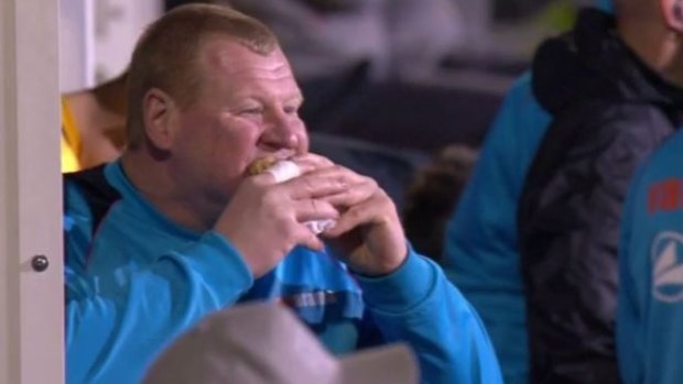 Tucking in: Wayne Shaw eats a pie in the dug-out during the FA Cup clash.