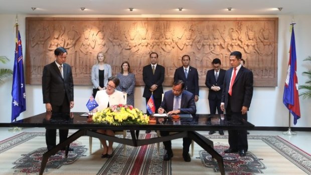 Angela Corcoran signs an MoU with Cambodian's Minister of Foreign Affairs Prak Sokhonn on October 18.