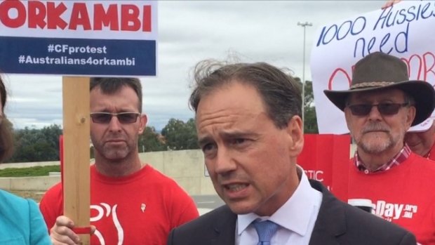 Health Minister Greg Hunt with Cystic Fibrosis Australia protesters.