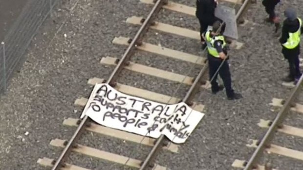 The banner left by protesters on the tracks.