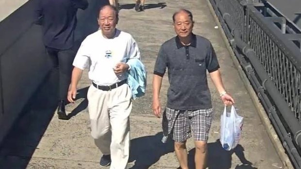 A CCTV image of two men police would like to speak with over an indecent assault on the Sydney Harbour Bridge.