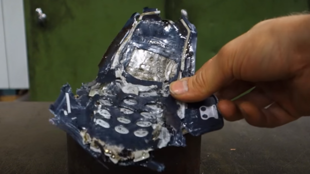 This is what a Nokia 3310 looks like after being crushed in a 100 ton hydraulic press.
