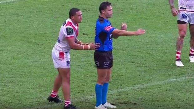 Minimal contact: Tyson Frizell touches referee Henry Perenara during the Dragons' round-one win over Penrith.