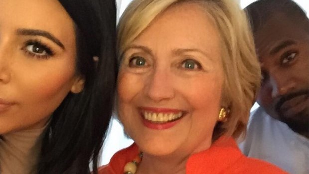 Selfie generation: Kim Kardashian and Kanye West take a happy snap with Hillary Clinton.