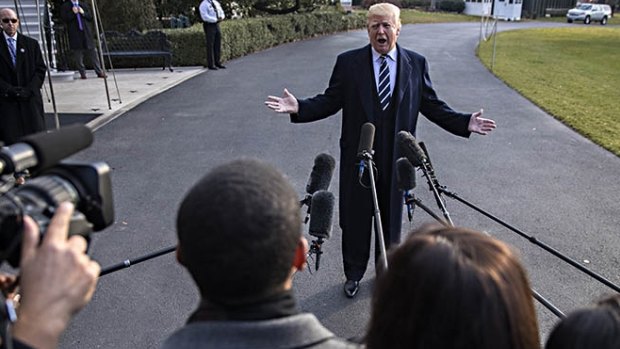 Donald Trump speaks to reporters on Saturday fresh off a victory in the Senate that puts him a step closer to passing a tax-cut bill.