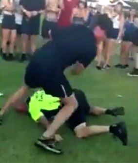 Michael Rigby collapses after he is kicked in the head at Claremont Festival.