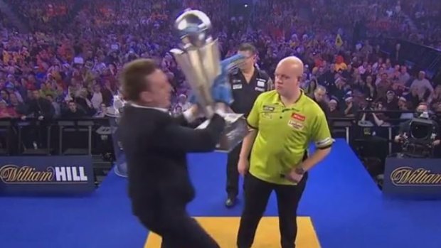 Michael van Gerwen wins World Darts Championship despite fan interruption