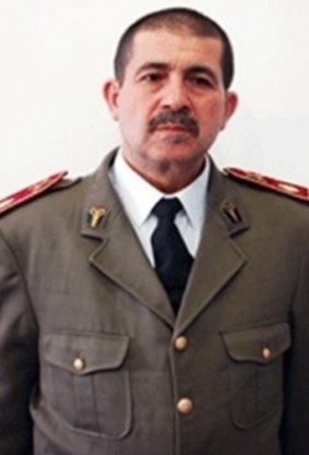 Fathi Bayoudh, seen here in his army uniform, was a "rather severe" man who "would have done anything" for his only son Anouar.