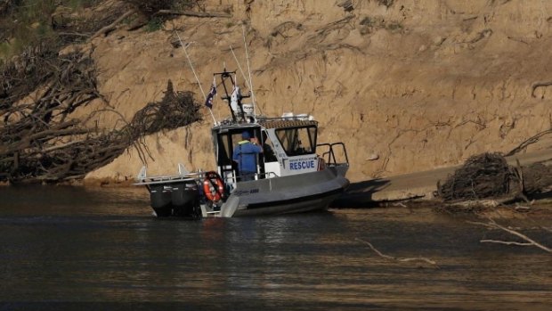 Police divers search the Murray River for the missing five-year-old after an alleged drowning attempt by his mother.
