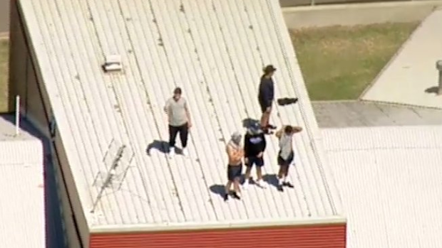 Youths on the roof of the Malmsbury Justice Centre.