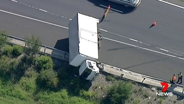 The truck has come to a rest on the side of the toll road in Carrum Downs.