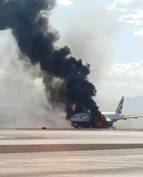 Smoke and flames stream from the stricken British Airways jet in Las Vegas.