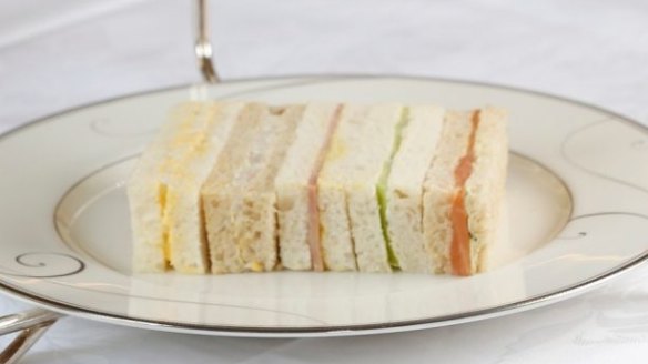 Neatly trimmed ribbon sandwiches on a tiered tea stand at Melbourne's Windsor Hotel.