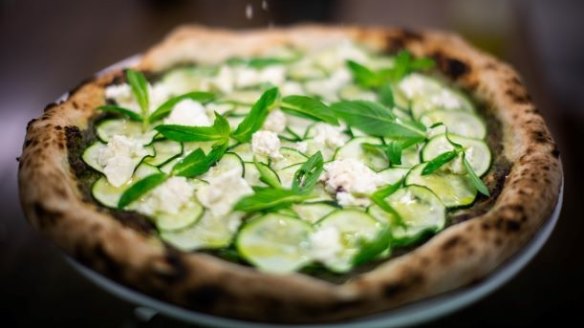 Green pizza with zucchini pesto, feta and mint.