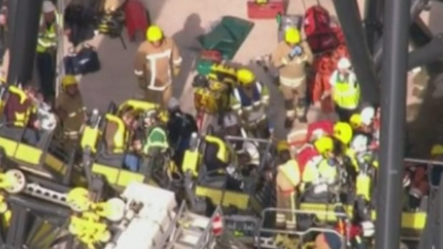 Emergency services free the injured from the British roller-coaster.