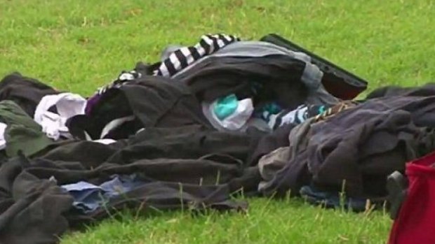 Men's clothes were strewn along the side of the road after Sunday's fatal incident. 