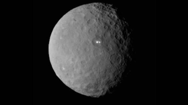 Two mysterious lights, filmed by NASA's Dawn space probe, appear on the surface of dwarf planet Ceres.