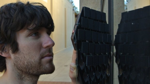 Elliot Hawkes, a Stanford doctoral student wearing one of the 'gecko gloves'.