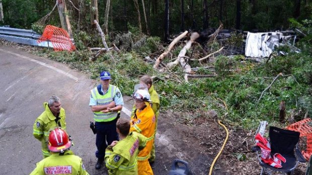 Crash investigators at the scene of a truck crash on Barrengarry Mountain on Friday.