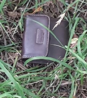 A brown 'Rosetti' purse located in the laneway between 108 and 110 Badimara Street, Fisher. 