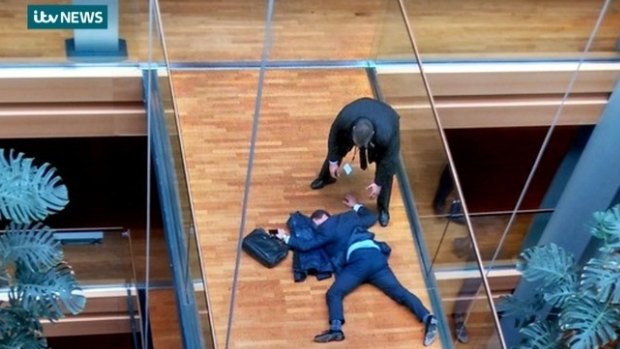 ITV grab of Steven Woolfe sprawled face-down on a Strasbourg parliament walkway.