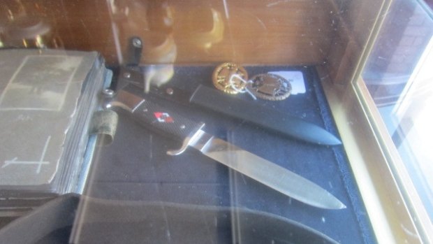 Weapon: Items of Nazi memorabilia sold at an ACT auction house on Sunday.