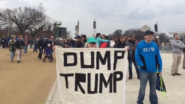 A lone silent protester on the sparsely populated National Mall just before Donald Trump's swearing in.